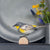 DecoBird Geelstuitzanger